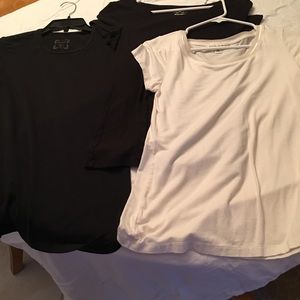 3 t- shirts, Black are mediums, cream is small